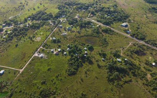 This is a solid investment opportunity in rural Belize! Located just off the Northern Highway, this 7-Acre parcel is cleared and ready to begin development. Sandhill Village